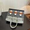 Birkin_Faubourg_20_Craftsmanship-Light Grey Dark Grey White Orange Bag
